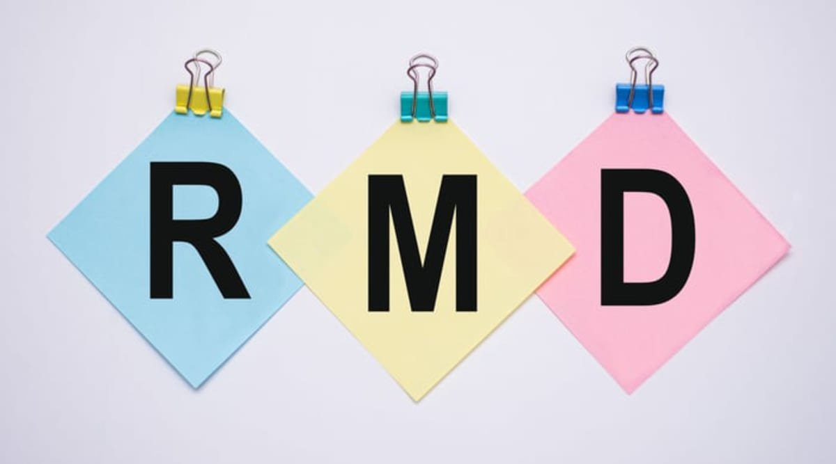 RMD letters on blue, yellow, and pink notes secured with colorful binder clips