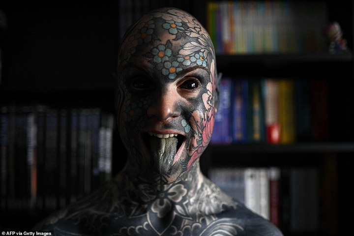 French primary school teacher who spent ?35k covering his body in tattoos is banned from kindergarten because he gives children nightmares (photos)