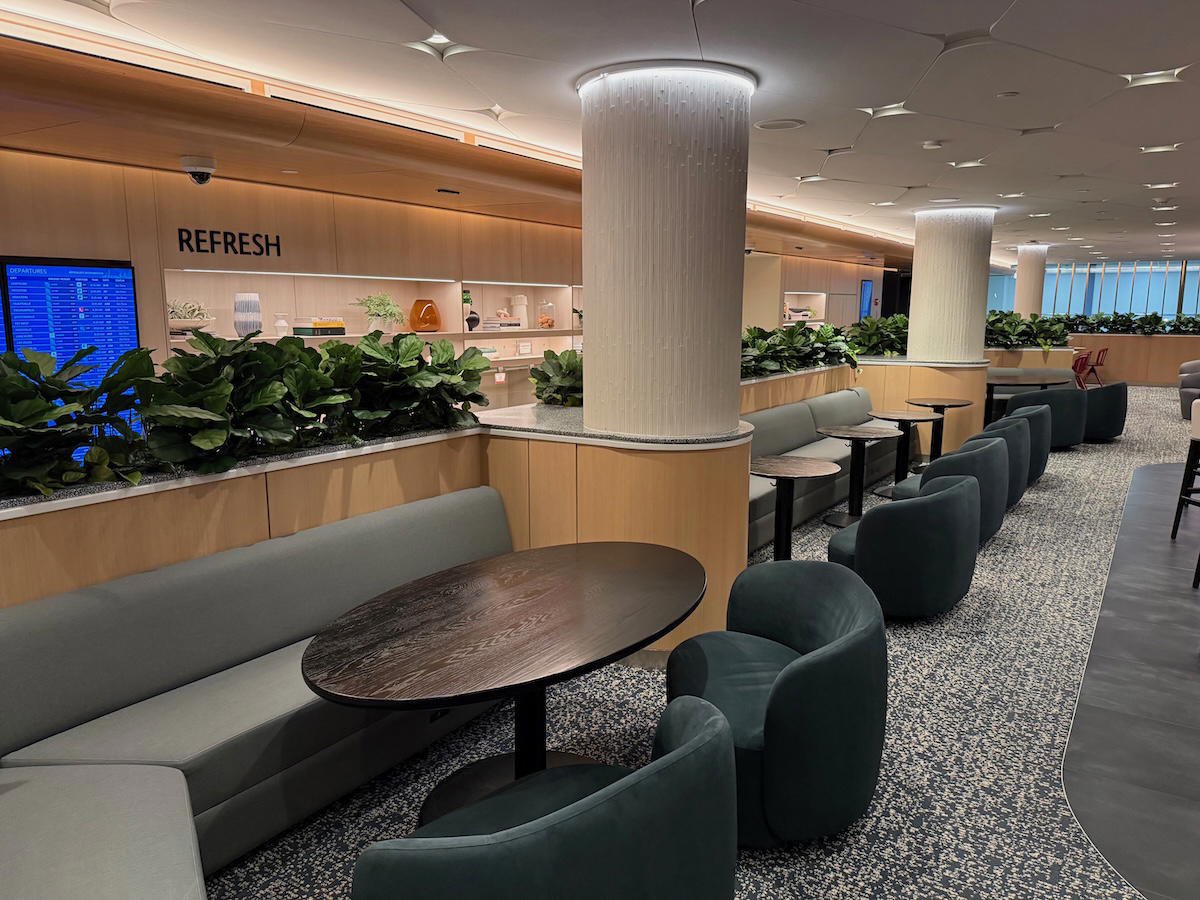 Seating and dining area inside the Capital One Lounge at Washington Dulles Airport