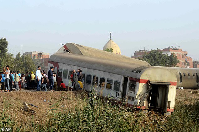 At least 11 people are killed and 100 injured as four passenger train carriages derail in Egypt?(photos)