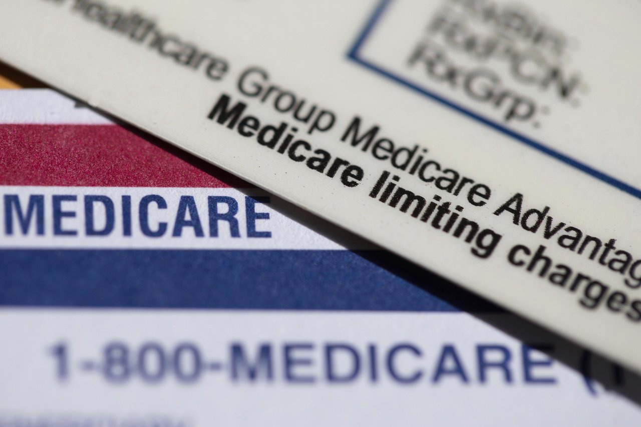 FILE - A Medicare Advantage PPO card rests on top of a Medicare card in Portland, Ore., June 10, 2024. (AP Photo/Jenny Kane, File)