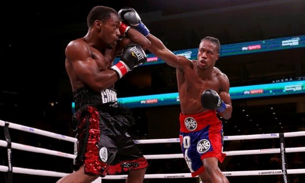 Patrick Day, right, lands a punch on Charles Conwell during the third round of their super welterweight fight on Saturday in Chicago. Photograph: Dylan Buell/Getty Images