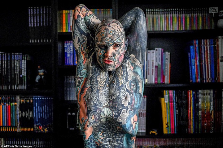  French primary school teacher who spent ?35k covering his body in tattoos is banned from kindergarten because he gives children nightmares (photos)