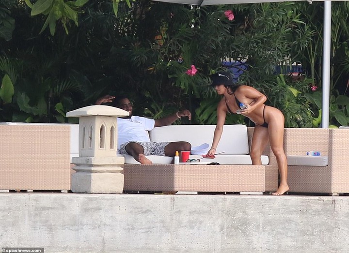 P. Diddy spotted with another mystery woman at his Miami Beach mansion few days after he was pictured kissing model Tina Louise (Photos)