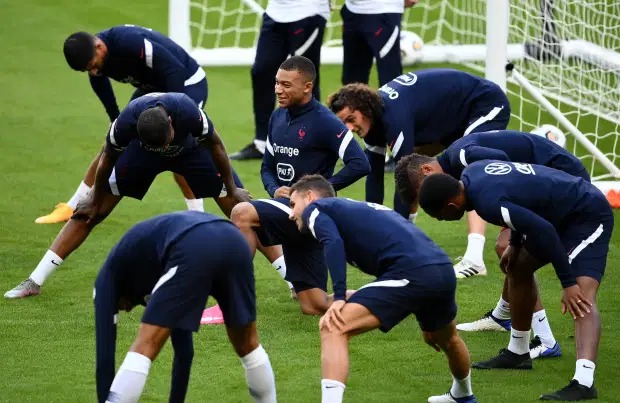 PSG striker, Kylian Mbappe pictured hugging France team-mates in training hours before testing positive for coronavirus?(photos)