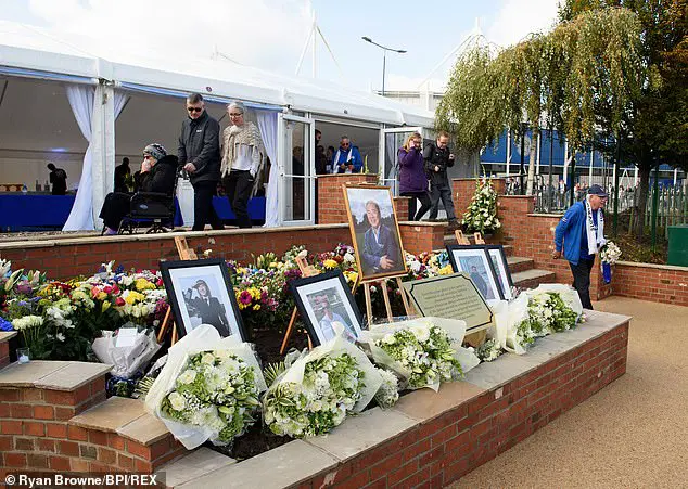 Flowers, wreaths and tributes were left in the garden on the first anniversary of the crash