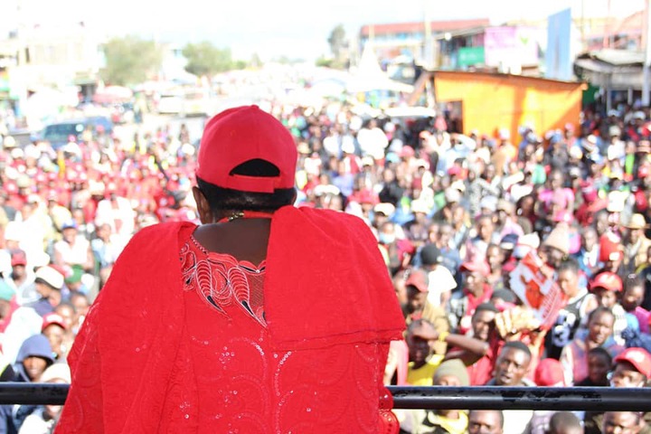 May be an image of 1 person, standing, outdoors and crowd