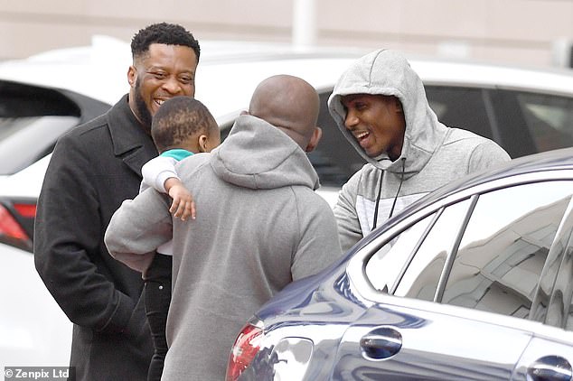 Ighalo fussed over a baby and enjoyed chatting with friends in the hotel's car park