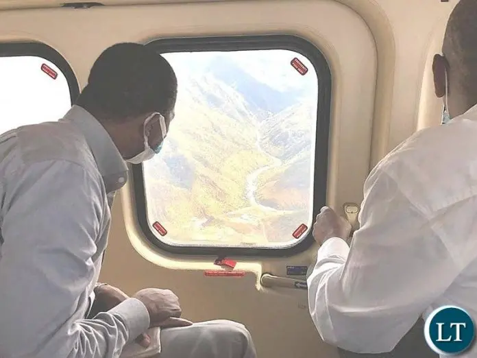 President Lungu getting an Arial view of the Water draining into Kariba Dam