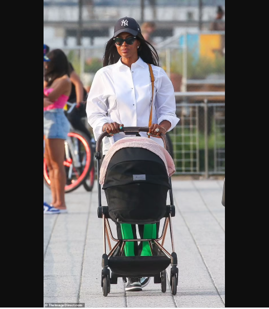 Supermodel Naomi Campbell, 50, is seen in public with her newborn daughter for first time (photos)