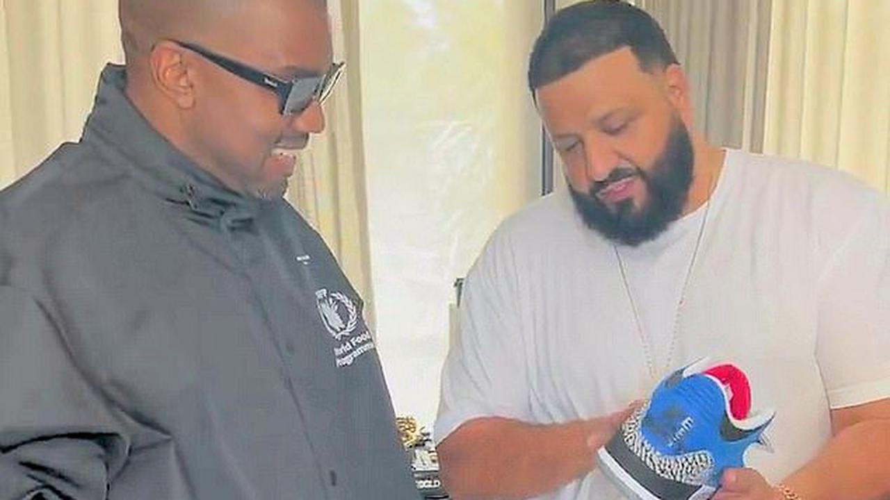 Kanye West flashes big grin as DJ Khaled gifts him a pair of extremely rare Jordan sneakers... while working on new music in producer's home studio