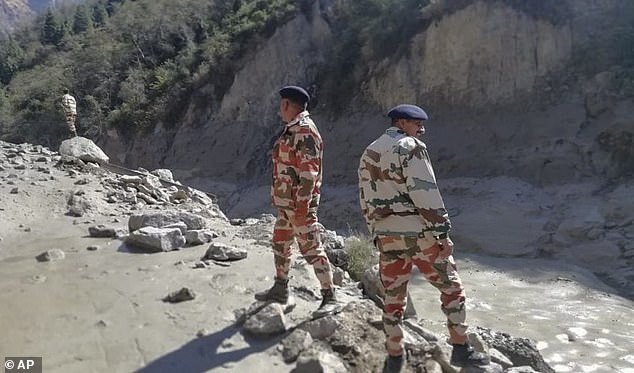 At least 200 people are missing and nine killed after mountain glacier crashed into dam and triggered massive flood in India?(photos)