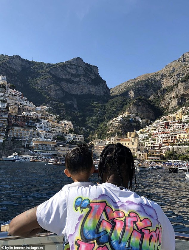 Happiness: Stormi and Travis cuddling in a snap from their Italian yacht getaway for Kylie's 22nd birthday was also included