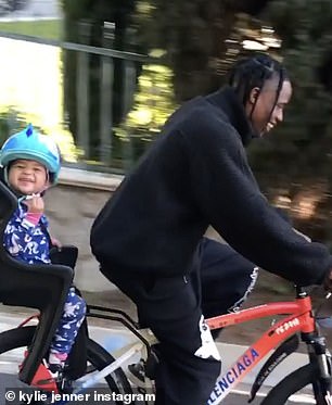 The final slide a short clip of them on a bicycle.