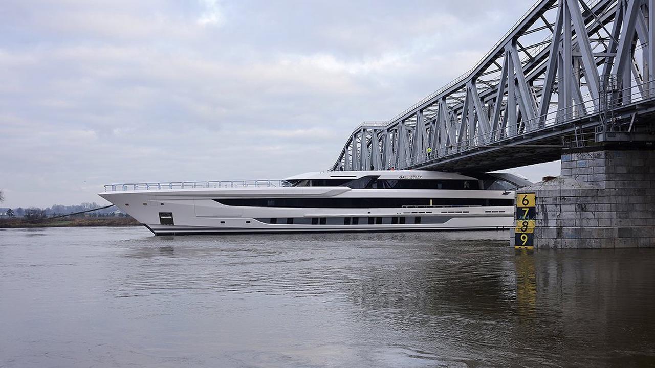 Multimillion-pound super-yacht scrapes under rail bridge with INCHES to spare