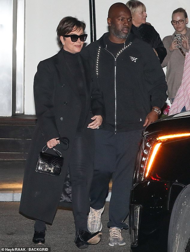 On theme: Kris matched her daughter in all-black, with a long black double-breasted overcoat over black leggings, while Corey opted for a more casual black hoodie and sweatpants