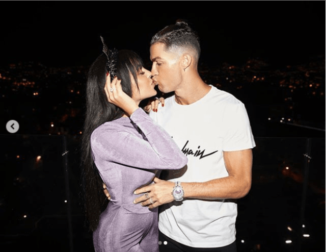 Cristiano Ronaldo and his partner Georgina Rodriquez lock lips together as they celebrate the New Year (photos)