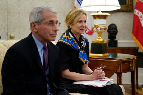 White House coronavirus response coordinator Dr. Deborah Birx, right, and Director of the National Institute of Allergy and Infectious Diseases Dr. Anthony Fauci attend a meeting about the coronavirus with Louisiana Gov. John Bel Edwards and President Donald Trump in the Oval Office of the White House, Wednesday, April 29, 2020, in Washington. (AP Photo/Evan Vucci)