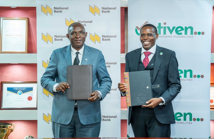 May be an image of one or more people, dais and text that says 'National Bank National Bank National nk Nationak Bank National Bank tiven... NSPIRINGPOSSIBILITIES NSPIRING POSSIBILITIES ational nk CESTIISATE nal en... BILITIES National Bank и4KoHp en... SSIBILITIES'