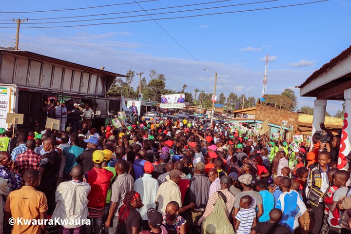 May be an image of one or more people, people standing, people walking, motorcycle, crowd, road and text that says "AGU AG AAI ©KwauraKwaura"