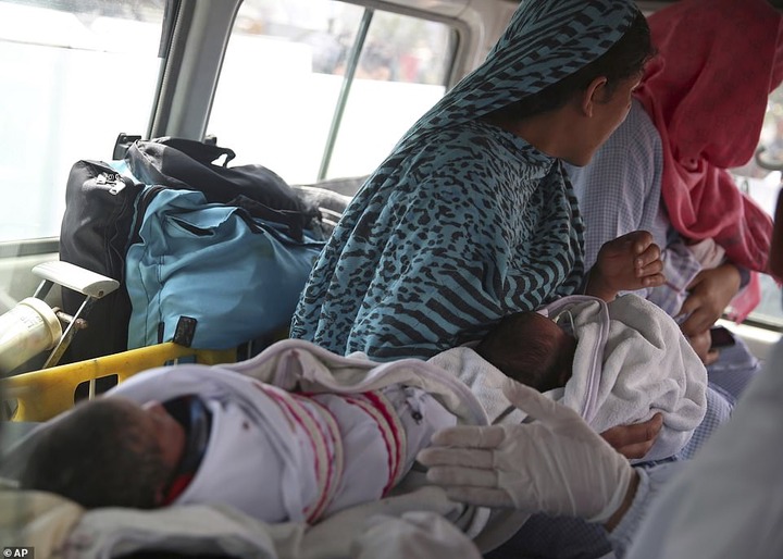 Some surviivors of the Afghanistan maternity ward shooting by ISIS gunmen being transported to safety