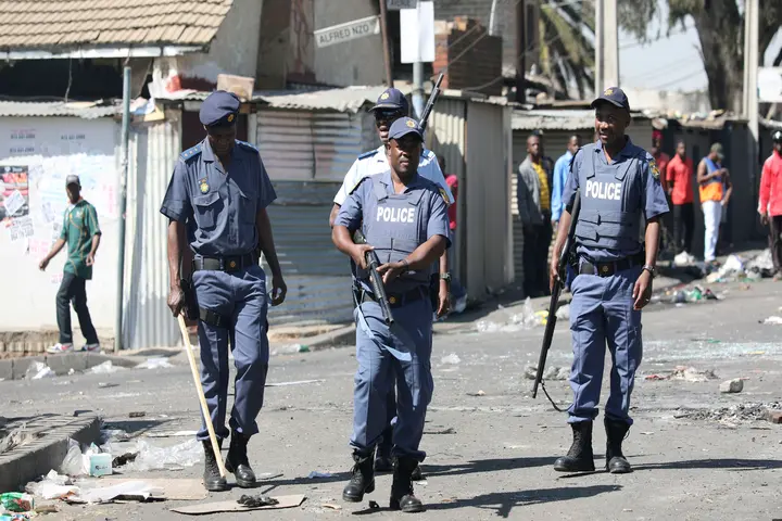 FILE PHOTO: Police patrol the streets after overnight unrest and looting in Alexandra township, Johannesburg, South Africa, September 3, 2019. REUTERS/Marius Bosch/File Photo