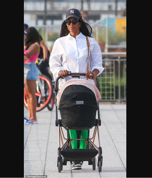 Supermodel Naomi Campbell, 50, is seen in public with her newborn daughter for first time (photos)