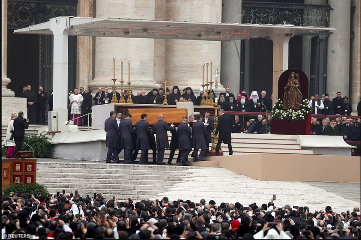 Pope Francis presides as Pope Benedict XVI is laid to rest (photos)