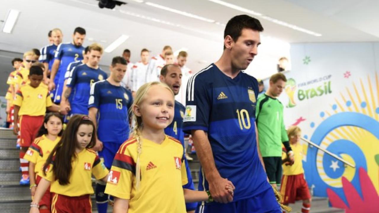 Personal: Why do children stand in front of footballers before every game?