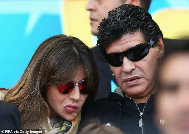 Diego Maradona (right) and his daughter Giannina Maradona look on during the 2014 FIFA World Cup Brazil Group F match between Argentina and Iran at Estadio Mineirao on June 21, 2014 in Belo Horizonte, Brazil. (Photo by Ryan Pierse - FIFA/FIFA via Getty Images)