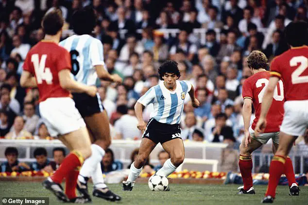 Diego Maradona in his playing days takes on the Belguim defence during the 1982 FIFA World Cup match between Argentina and Belguim at the Nou Camp stadium on June 13, 1982 in Barcelona