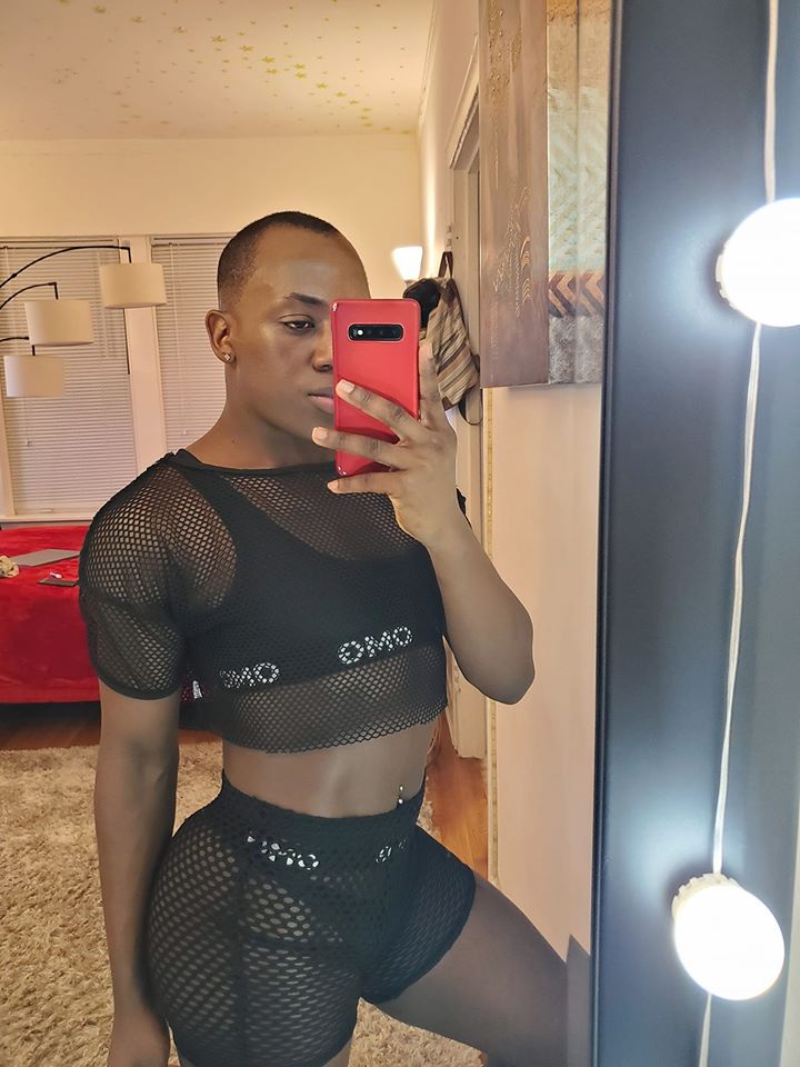 Image may contain: 1 person, standing, phone, selfie and indoor