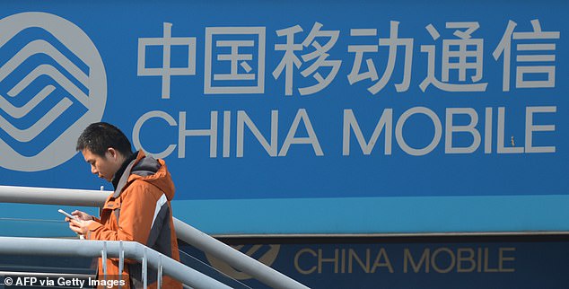 A China Mobile sign in Shangahi. The world's largest mobile network is set to buy the largest phone network in the Pacific Islands as trade disputes rise between Australia and China