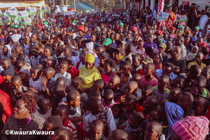 May be an image of child, crowd, outdoors and text that says "S ©KwauraKwaura"