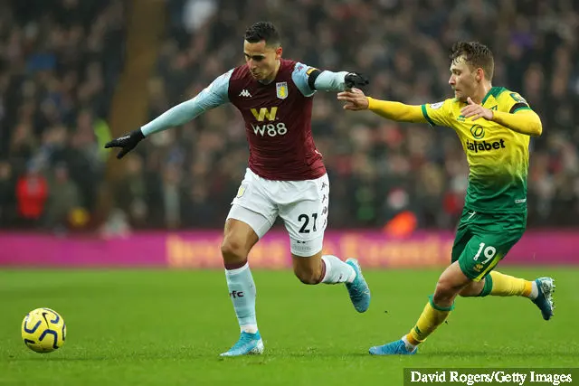 Anwar El Ghazi of Aston Villa battles for the ball with Tom Trybull of Norwich City during the Premier League match between Aston Villa and Norwich City at Villa Park on December 26, 2019...