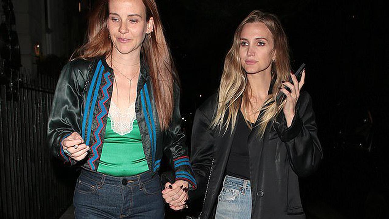 Ashlee Simpson cuts a casual figure in a black top and ripped jeans as she steps out with a friend at private members' club The Twenty Two