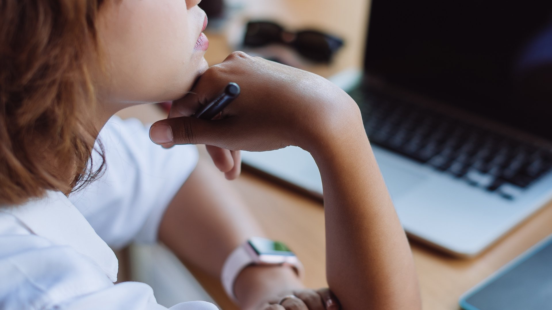 Discover a young woman thinking about how to approach her finances differently or changing money mindset.