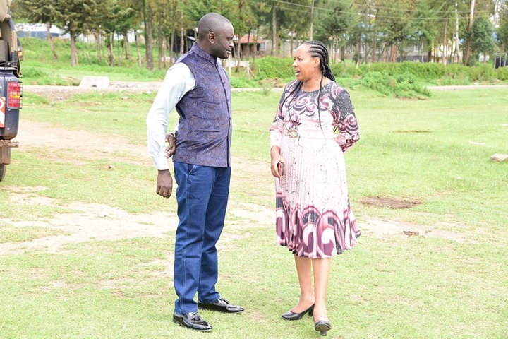 May be an image of 2 people, people smiling and grass