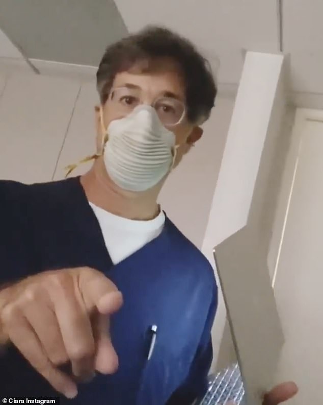 Safety first: Meanwhile both the medical professional and the native Texan wore masks to protect themselves against the potentially deadly coronavirus sweeping the United States