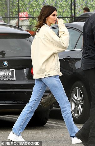 Simply stunning: Kendall Jenner wore a beige denum jacket with blue joggers