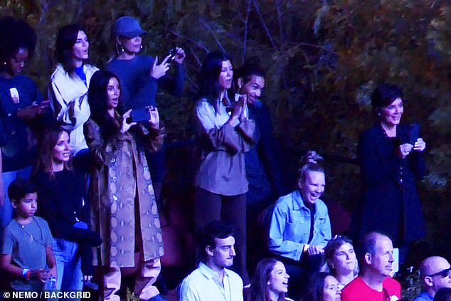 Support system: Kanye's wife Kim Kardashian was also obviously there to support as she was seen happily filming the concert, as Sia was also in attendance next to momager Kris Jenner (bottom right)