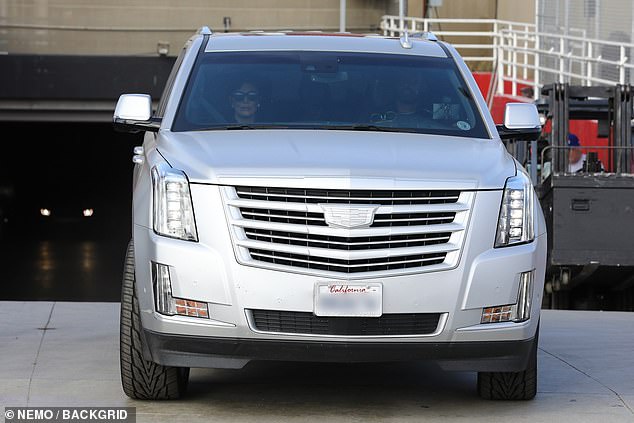 On the go: Kendall was later seen out and about in Los Angeles as she supported her brother-in-law by wearing a blue Jesus Is King sweatshirt