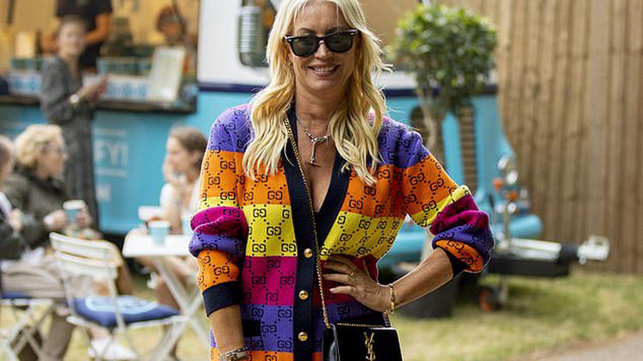 Denise Van Outen puts on a leggy display in a denim miniskirt and multicoloured Gucci cardigan as she attends Adele's BST Hyde Park show after confirming new romance