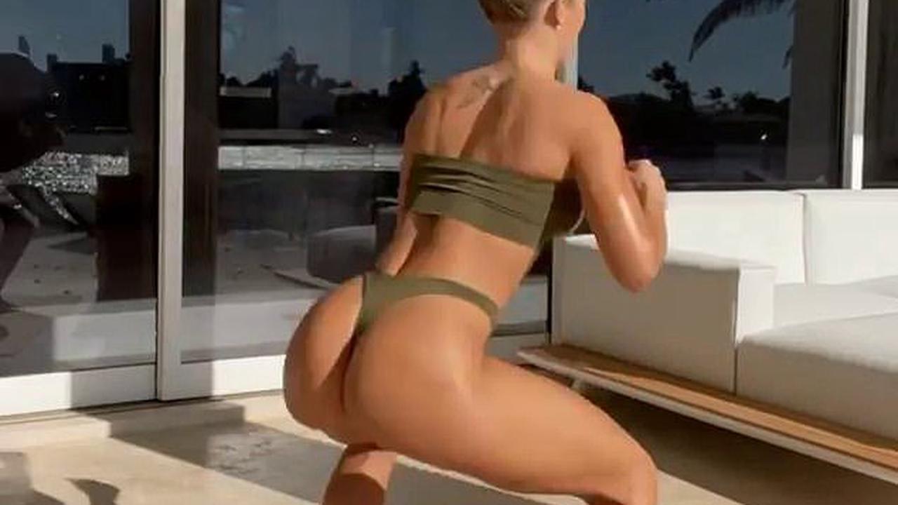 Squatting in thong