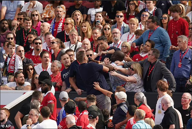 Manchester United fans fight each other in the stands at Old Trafford as they are beaten by Brighton (photos)