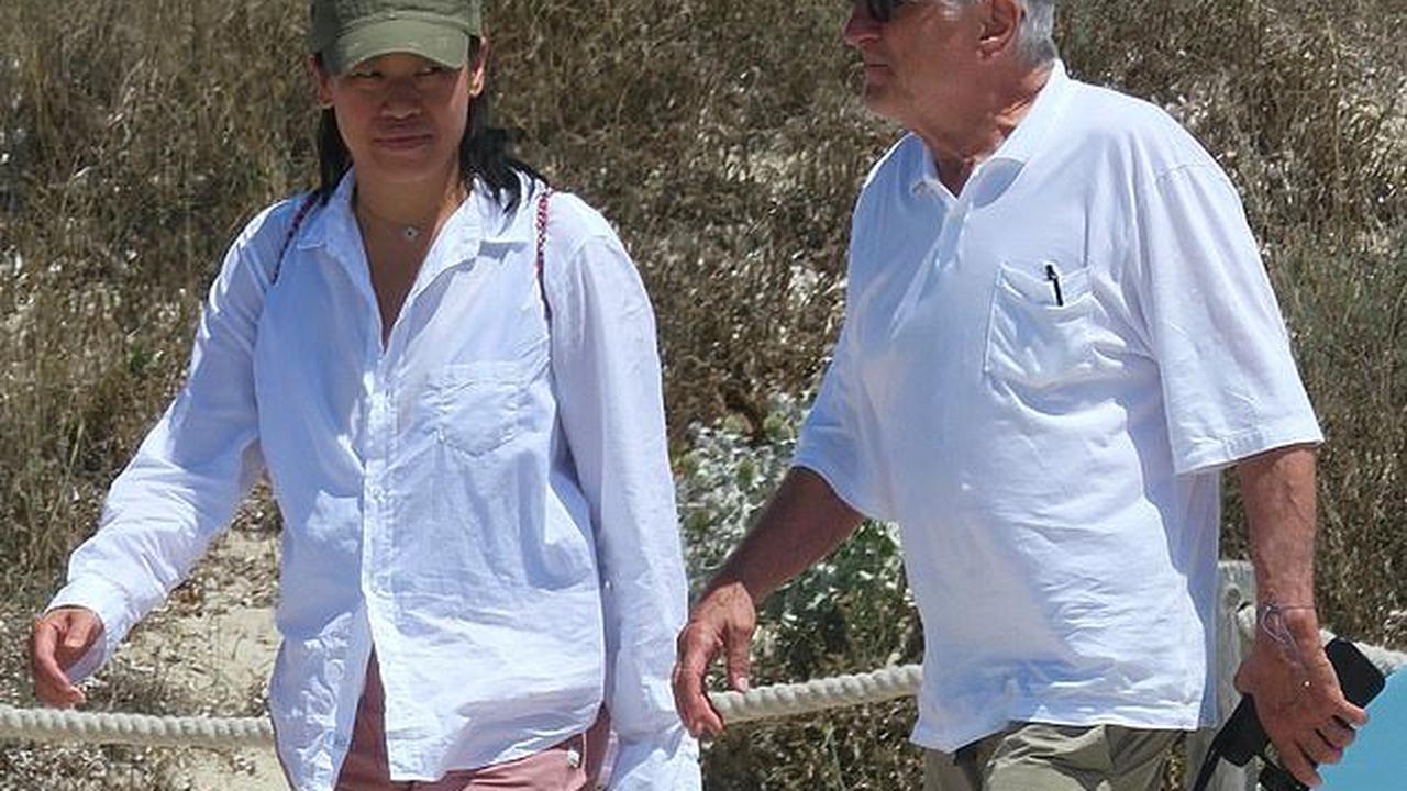You walkin' with me? Robert De Niro, 78, is joined by rumoured girlfriend Tiffany Chen as screen veteran takes a stroll on Formentera beach