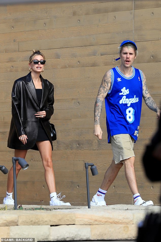 Star time: Hailey looked sleek in a black leather coat over a black skirt at the restaurant, a favorite with celebrities