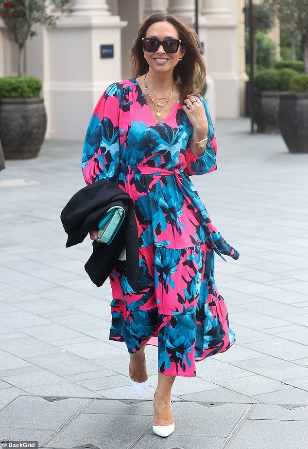 Myleene Klass stands out in neon pink and blue floral print dress as
