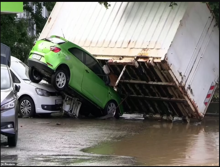 20 dead and 70 people missing as floods destroy buildings and leave families trapped on rooftops in Germany (photos)