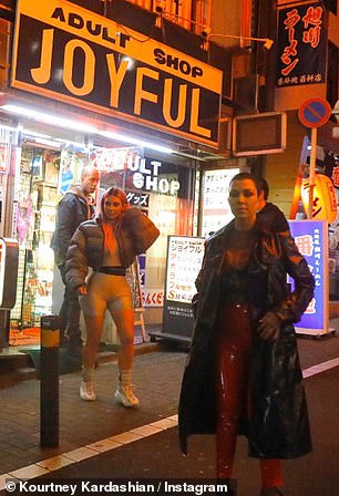 Sister trip: Unlike Khloé, 35, who didn't appear in any of the mother-of-three's pictures, Kim could be spotted in the background of two with her bright pink hair